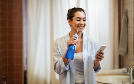 Patient in Clearwater using a water flosser