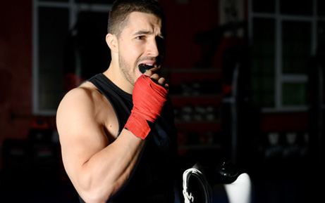 Patient in Clearwater wearing mouthguard to prevent dental emergencies