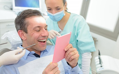 Patient in Clearwater smiling with dental implants