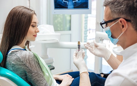 Patient in Clearwater talking to dentist about dental implants
