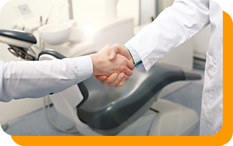 Person shaking hands with their dentist