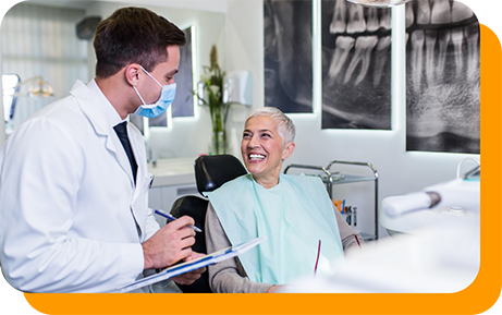 Senior woman in dental chair grinning at her dentist