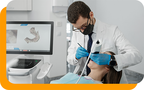 Dentist taking digital impressions of a patients teeth