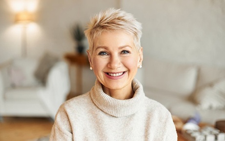 a woman smiling in the comfort of her home