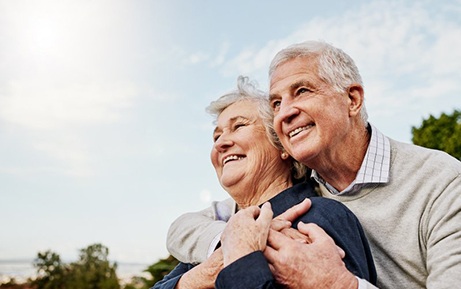 an older couple smiling and enjoying time together