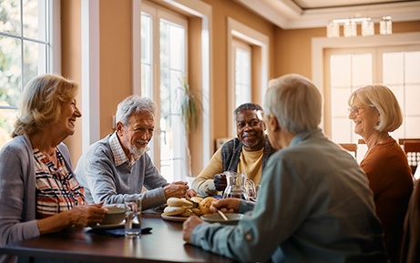 Group of friends smiling at restaurant
