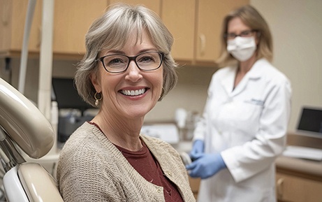 Woman smiling while sitting in treatment chair