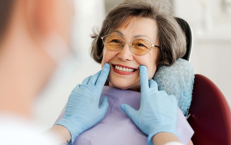 Dentist examining patient's smile