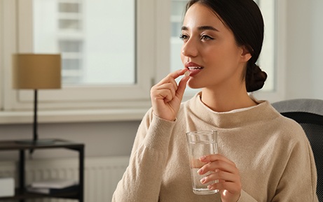 Woman taking a pill
