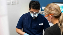 Doctor Cannady and assistant performing a dental procedure on a patient