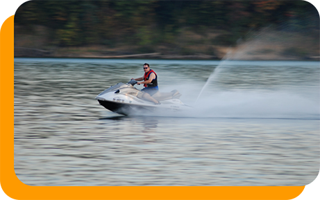 Man riding a one person boat on a lake