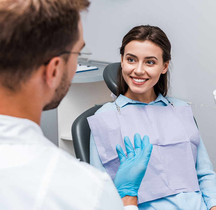 Woman smiling at her dentist during a preventive dentistry checkup in Clearwater