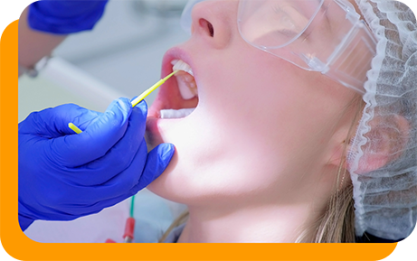 Dental patient having fluoride applied to their teeth